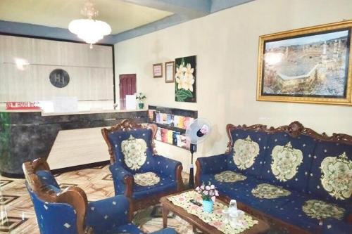 Гостиная зона в Hotel Indah Grogot Syariah Mitra RedDoorz