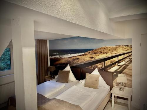a bedroom with a bed with a view of the ocean at Hotel Am Volksgarten in Düsseldorf