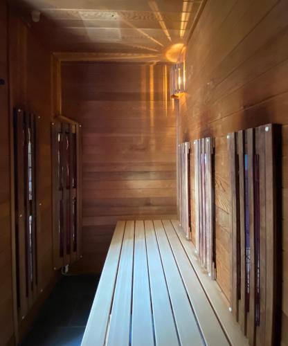 an empty sauna with wooden walls and wooden floors at Hotel Fortuna Reutlingen-Tübingen in Reutlingen