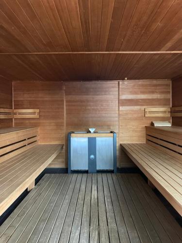 a empty sauna with wooden walls and wooden floors at Hotel Fortuna Reutlingen-Tübingen in Reutlingen