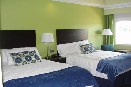 מיטה או מיטות בחדר ב-Starlight Inn