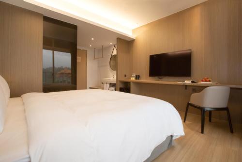 TV a/nebo společenská místnost v ubytování Hotelday Sun Moon Lake