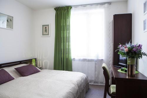 A bed or beds in a room at Lavanda Hotel&Apartments Prague