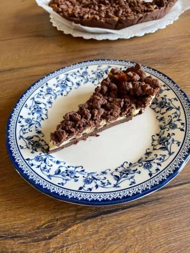 a slice of pie on a blue and white plate at Agriturismo Casale Cerere in Lacedonia