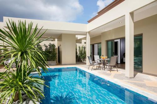 an image of a swimming pool in a villa at Shanti Villas x MonthStayZ Thailand in Rawai Beach