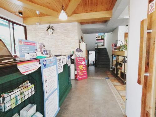 a grocery store with a counter in a room at Hangzhou Citynest Music B&B in Hangzhou