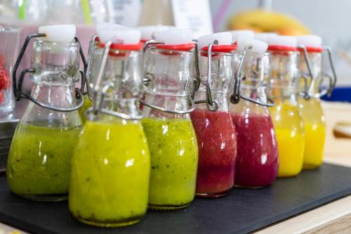 a group of bottles of juice on a black tray at Petit Palace Plaza Mayor in Madrid