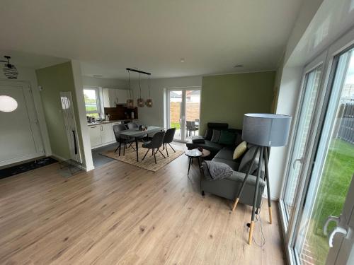 a living room with a couch and a table at Wangerbrise in Wangerland