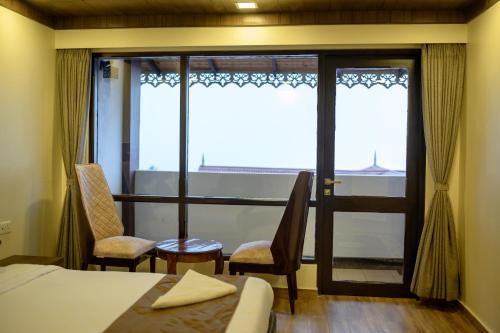 Postel nebo postele na pokoji v ubytování Istana Resort & Spa