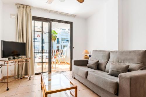 Телевизор и/или развлекательный центр в Club Tenerife Apartments