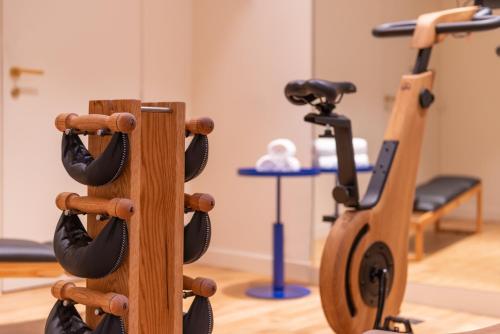 a group of two exercise bikes in a gym at Hotel Yllen Eiffel in Paris