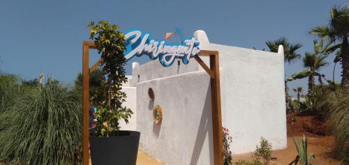 a sign that is on the side of a building at Bahia Golf Beach Bouznika appart in Bouznika