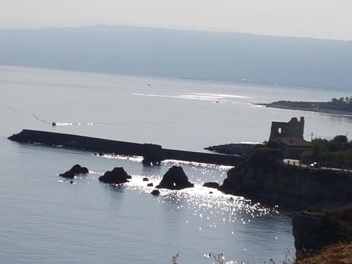 an island in the water with a building on it at Casa a Cocca in Briatico