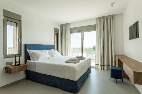 Postel nebo postele na pokoji v ubytování Manitennisvillas