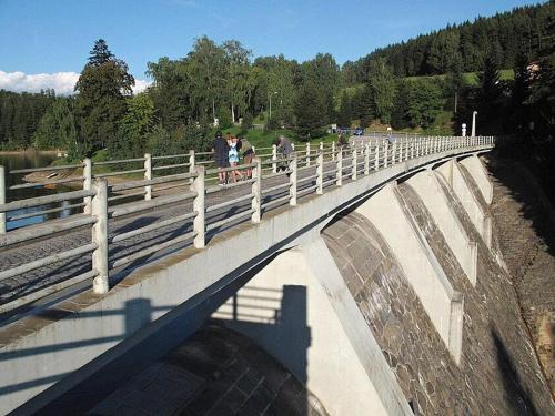 a group of people walking on a bridge at Penzion Pastviny in Pastviny