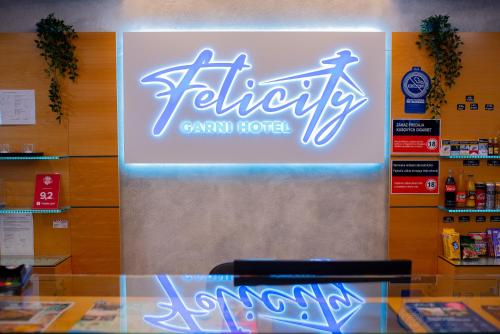 a sign for a canadian hotel in a store at Felicity Garni Hotel in Bratislava