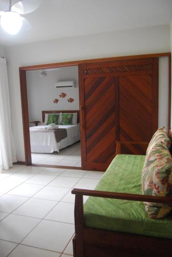 En eller flere senge i et værelse på Bahia Bonita Flat