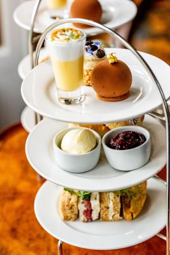 a three tiered plate with different types of food at Melville Castle Hotel in Edinburgh