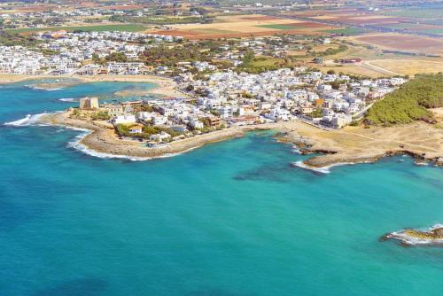 an aerial view of a town next to the ocean at Donnosanto Residence in Torre Santa Sabina