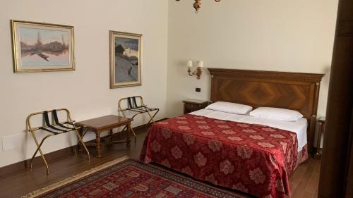 Postel nebo postele na pokoji v ubytování Notti sull'Adige