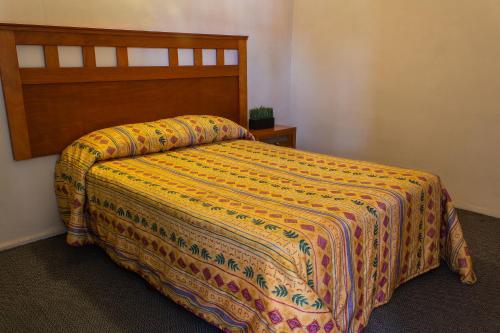 Ein Bett oder Betten in einem Zimmer der Unterkunft BONITTO INN® Manuel