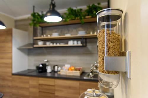 a container of food is hanging on a wall in a kitchen at IL MULINO in Concordia sulla Secchia
