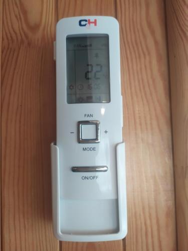 a white nintendo wii remote sitting on a table at Mikalojiškis in Inturkė