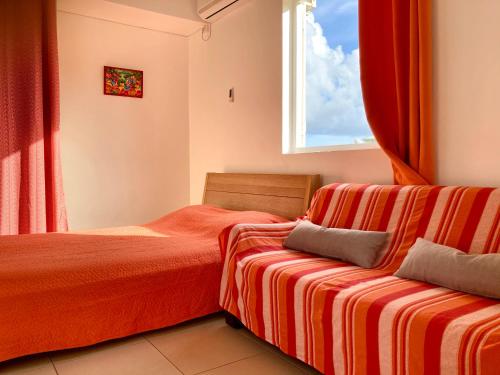 A bed or beds in a room at Residence Soleil Demery