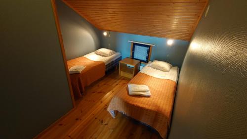 Postel nebo postele na pokoji v ubytování Hotel Guossi