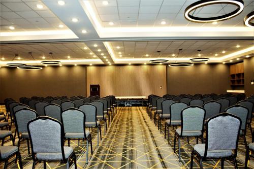 a conference room with rows of chairs in it at Holiday Inn Fort Worth - Alliance by IHG in Fort Worth