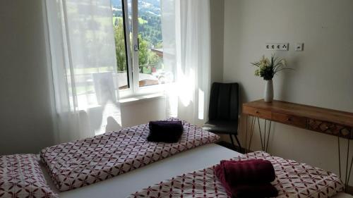 Postel nebo postele na pokoji v ubytování Alpenblick