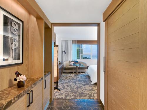 a corridor of a hotel room with a bedroom at Nobu Hotel Miami Beach in Miami Beach