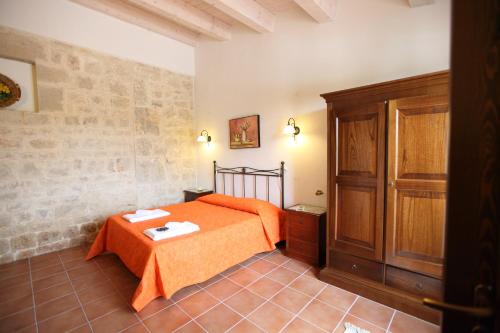 A bed or beds in a room at Agriturismo Serrafiori