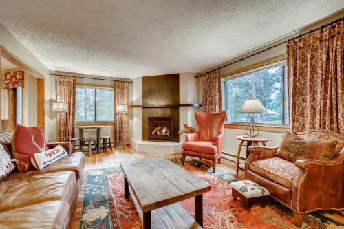 a living room with a couch and a fireplace at Casa de Montagne Home: High-End Log Home, Downtown Frisco in Frisco