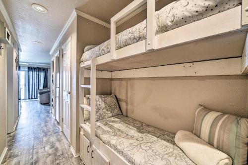 a room with three bunk beds in a house at Updated Front Beach Condo w/ Resort Amenities! in Corpus Christi