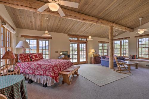 a large bedroom with a bed and a couch at Bright Prescott Studio with Thumb Butte Views! in Prescott