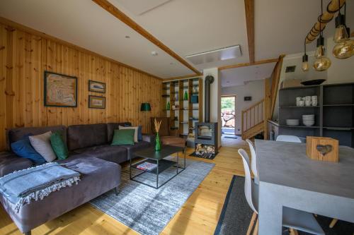 a living room with a couch and a table at CHALET am Schneeberg See in Puchberg am Schneeberg