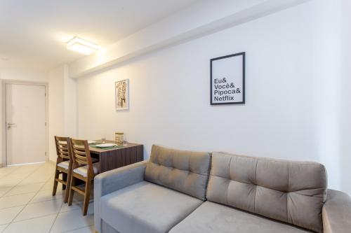a living room with a couch and a table at Beach Class Santa Maria by Easy Home in Recife
