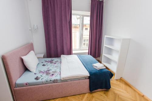 Postel nebo postele na pokoji v ubytování Апартаменти в центрі міста