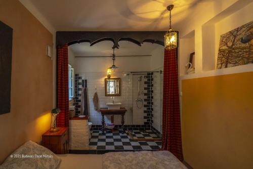 a bathroom with a shower and a sink in a room at Vidéki Ház-Őrség in Kerkafalva