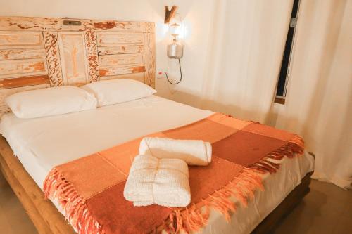Łóżko lub łóżka w pokoju w obiekcie Rancho das Estrelas