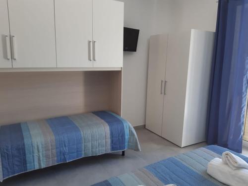 Postel nebo postele na pokoji v ubytování Casetta del Villaggio