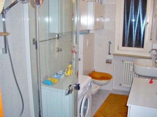 a bathroom with a shower and a toilet and a sink at Bozen Mitte in Bolzano