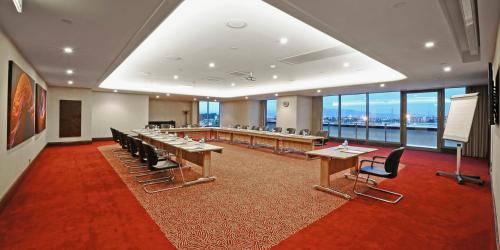 a conference room with desks and chairs in a building at Crowne Plaza Bursa Convention Center & Thermal Spa by IHG in Bursa