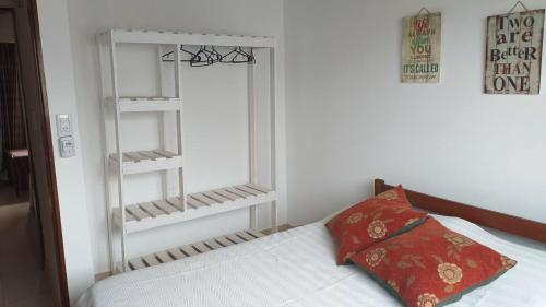 Ein Bett oder Betten in einem Zimmer der Unterkunft A metros de la Playa....