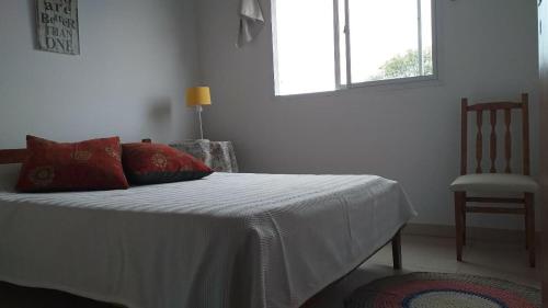 Ein Bett oder Betten in einem Zimmer der Unterkunft A metros de la Playa....