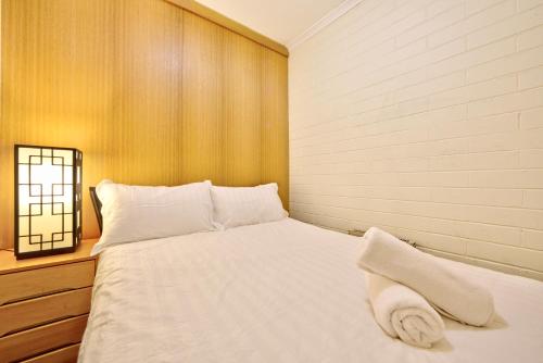 Postel nebo postele na pokoji v ubytování Snow Ski Apartments 34