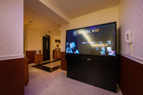 Télévision ou salle de divertissement dans l'établissement Hotel XiO エクシオ