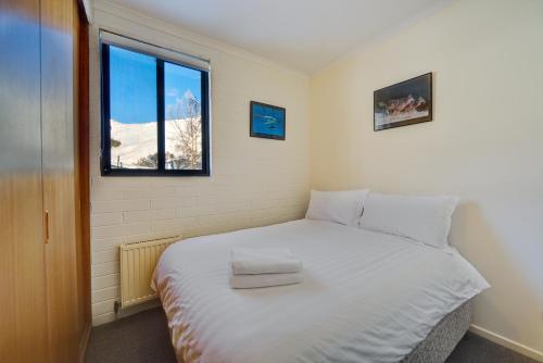 Ένα ή περισσότερα κρεβάτια σε δωμάτιο στο Snow Ski Apartments 06