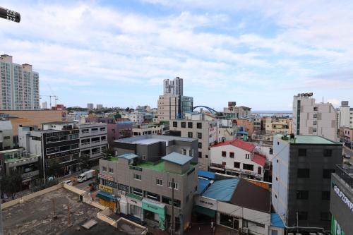 a view of a city with tall buildings at Sunrise Hotel Sokcho in Sokcho